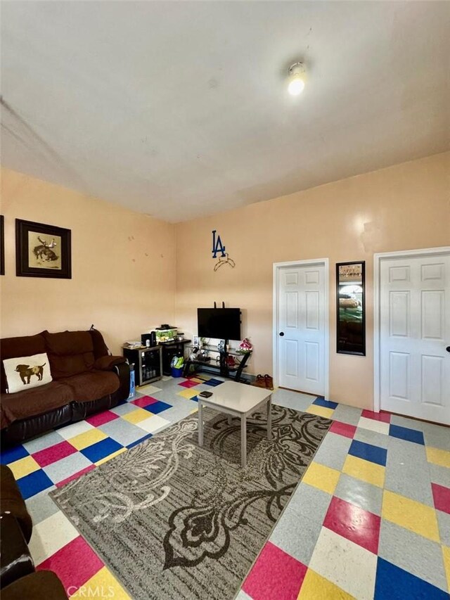 living area featuring tile patterned floors