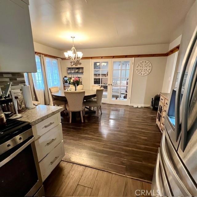 11406 Christy Ave, Sylmar, CA 91342 - dining space with an inviting chandelier and dark wood-style flooring