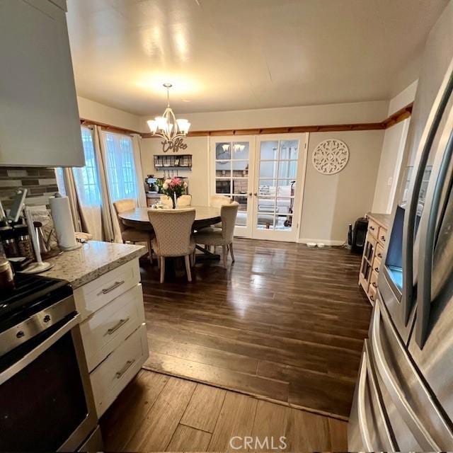 11406 Christy Ave, Sylmar, CA 91342 - dining area featuring a chandelier and dark wood-type flooring