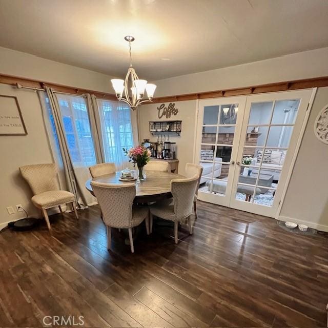 11406 Christy Ave, Sylmar, CA 91342 - dining area featuring french doors, dark wood-style floors, and a notable chandelier