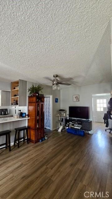 11406 Christy Ave, Sylmar, CA 91342 - living room featuring ceiling fan, wood finished floors, and a textured ceiling