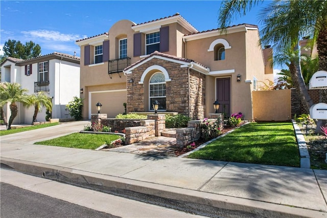 mediterranean / spanish house featuring driveway, stone siding, a tile roof, an attached garage, and stucco siding