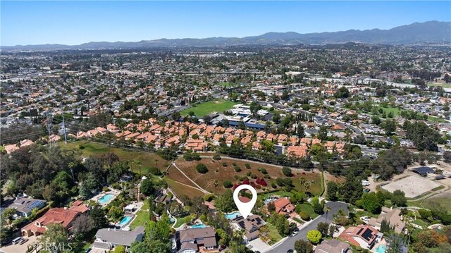 birds eye view of property featuring a mountain view and a residential view