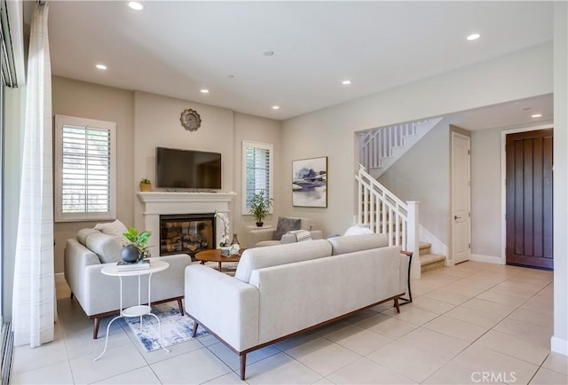 54 Rim Crst, Irvine, CA 92602 - living area with recessed lighting, a wealth of natural light, stairway, and a glass covered fireplace