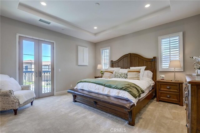 54 Rim Crst, Irvine, CA 92602 - bedroom with a tray ceiling, light colored carpet, visible vents, access to exterior, and multiple windows