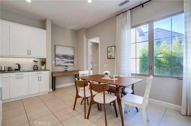 54 Rim Crst, Irvine, CA 92602 - dining area with baseboards, visible vents, and plenty of natural light