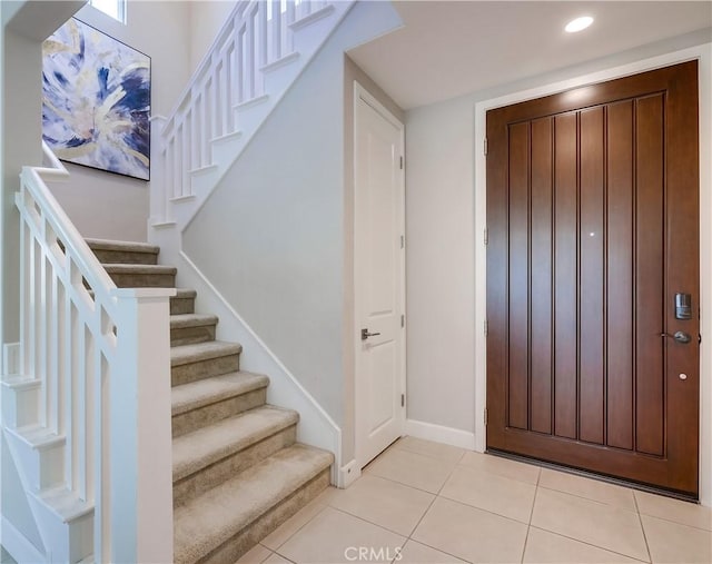 54 Rim Crst, Irvine, CA 92602 - foyer entrance featuring recessed lighting, stairway, baseboards, and light tile patterned floors