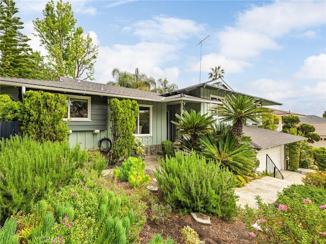 view of front of property featuring board and batten siding and a garage