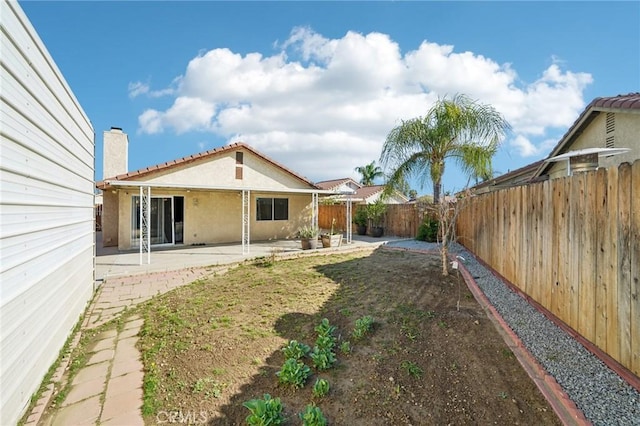 view of yard featuring a patio area and a fenced backyard