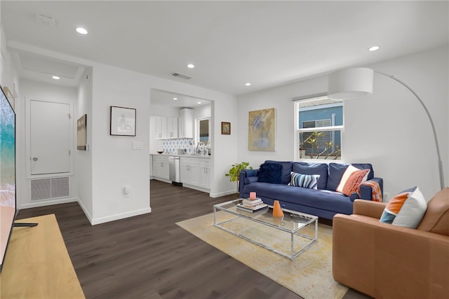 living room featuring dark wood finished floors, visible vents, and recessed lighting
