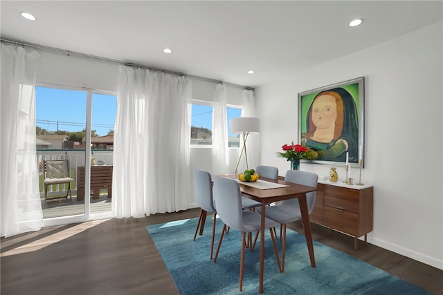 dining room featuring recessed lighting, baseboards, and wood finished floors