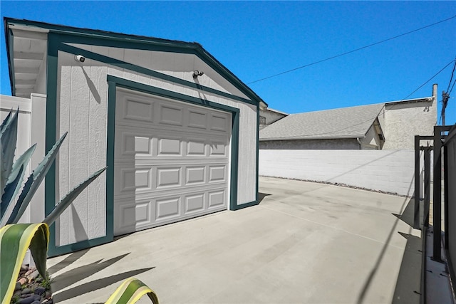 garage with fence