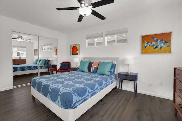 bedroom with a closet, baseboards, a ceiling fan, and wood finished floors