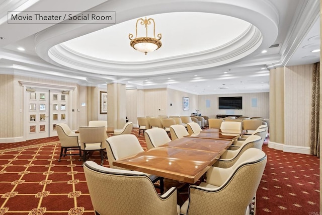 dining room with a tray ceiling, recessed lighting, carpet flooring, decorative columns, and crown molding