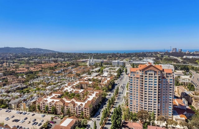 birds eye view of property with a mountain view and a view of city