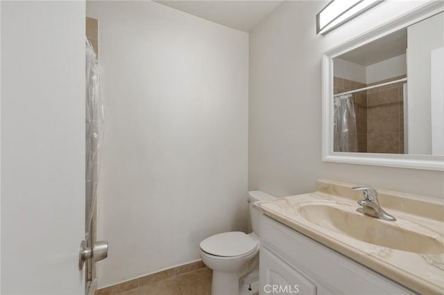 5055 Coldwater Canyon Ave Unit 105, Sherman Oaks, CA 91423 - full bath featuring vanity, toilet, tile patterned flooring, and a shower with shower curtain