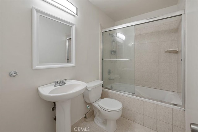 5055 Coldwater Canyon Ave Unit 105, Sherman Oaks, CA 91423 - full bathroom featuring toilet, tiled shower / bath combo, and tile patterned flooring
