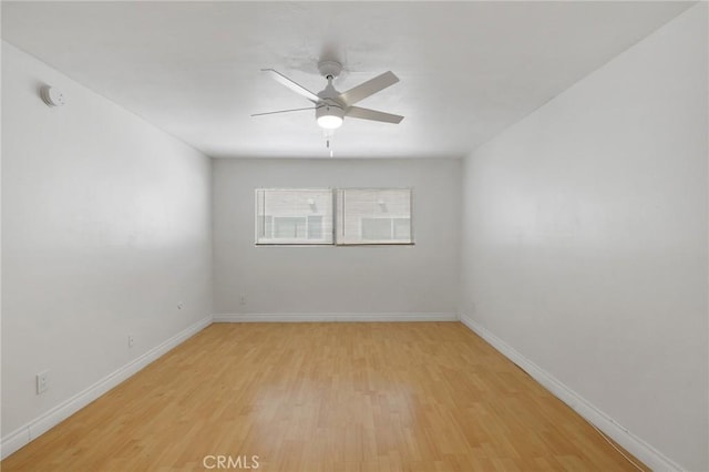 5055 Coldwater Canyon Ave Unit 105, Sherman Oaks, CA 91423 - empty room featuring a ceiling fan, light wood finished floors, baseboards, and a smoke detector