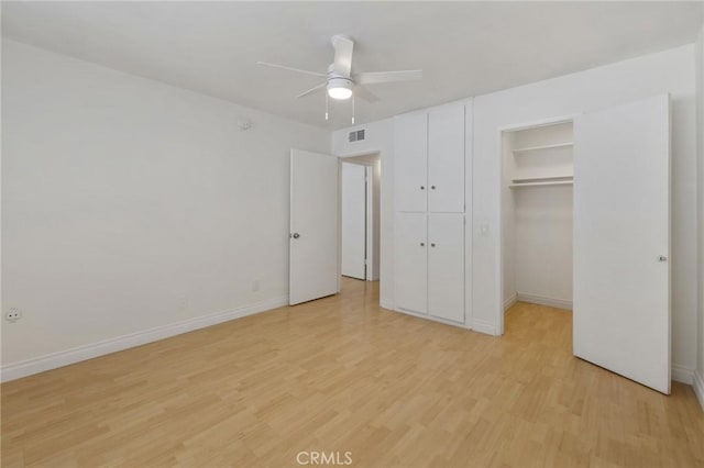 5055 Coldwater Canyon Ave Unit 105, Sherman Oaks, CA 91423 - unfurnished bedroom featuring light wood-style floors, baseboards, and a walk in closet