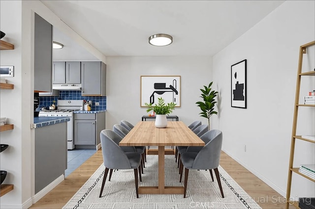 5055 Coldwater Canyon Ave Unit 105, Sherman Oaks, CA 91423 - dining room with light wood finished floors and baseboards