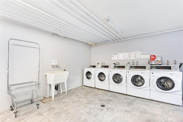 5055 Coldwater Canyon Ave Unit 105, Sherman Oaks, CA 91423 - community laundry room featuring washer and dryer and baseboards
