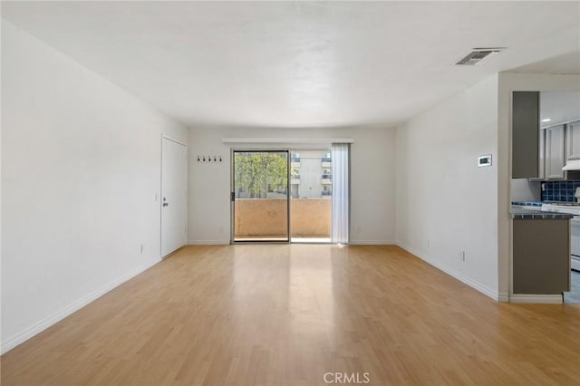 5055 Coldwater Canyon Ave Unit 105, Sherman Oaks, CA 91423 - unfurnished living room with light wood-type flooring and baseboards