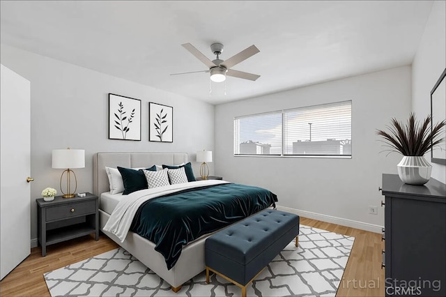 5055 Coldwater Canyon Ave Unit 105, Sherman Oaks, CA 91423 - bedroom with light wood-type flooring, baseboards, and a ceiling fan