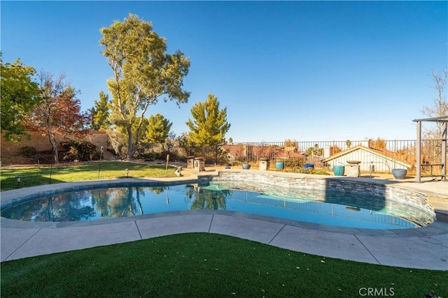 pool featuring a yard and fence