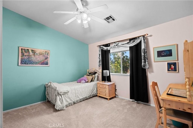 bedroom with visible vents, light colored carpet, baseboards, and lofted ceiling