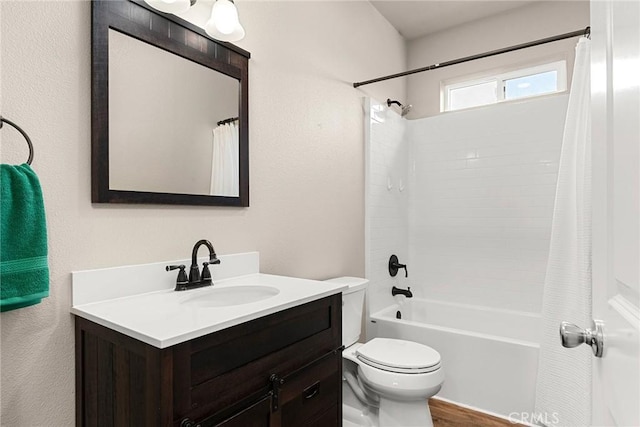 full bathroom featuring toilet, shower / bathtub combination with curtain, vanity, and wood finished floors