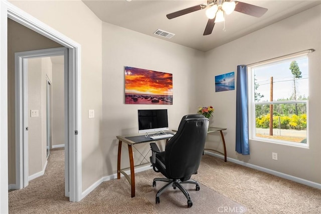 carpeted office with baseboards, a ceiling fan, and visible vents