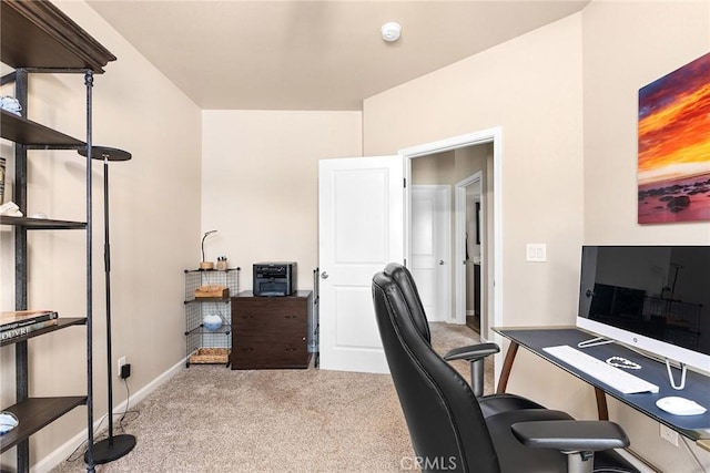office with baseboards and carpet floors