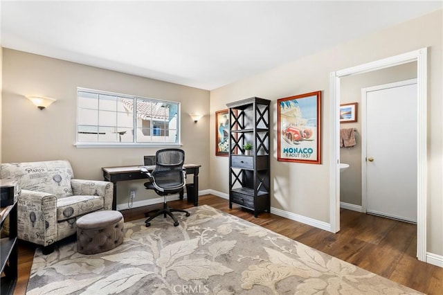 office area featuring baseboards and wood finished floors