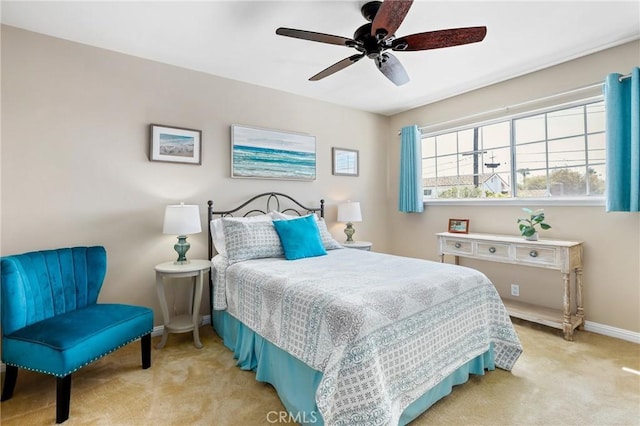 bedroom featuring carpet flooring, baseboards, and ceiling fan