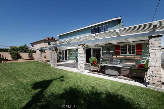back of property featuring a pergola, a patio, fence, and a lawn