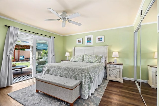 bedroom featuring baseboards, ornamental molding, access to exterior, ceiling fan, and wood finished floors