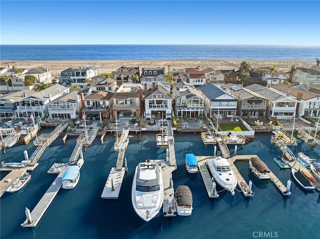 birds eye view of property with a residential view and a water view