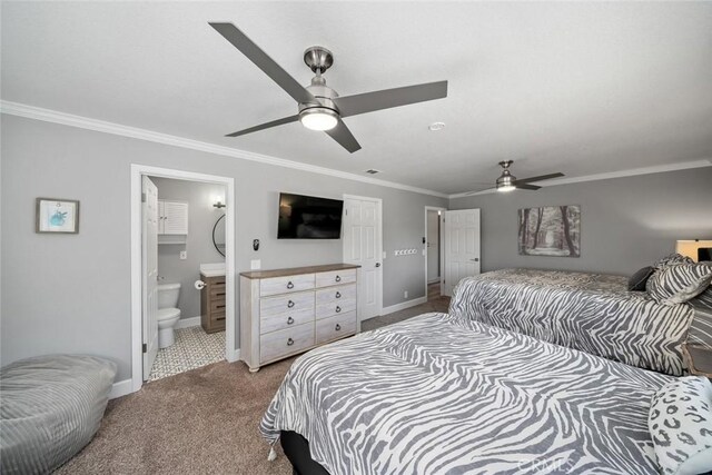 bedroom featuring ceiling fan, carpet, ensuite bath, ornamental molding, and baseboards