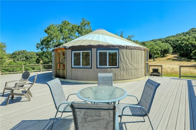 wooden deck with outdoor dining space