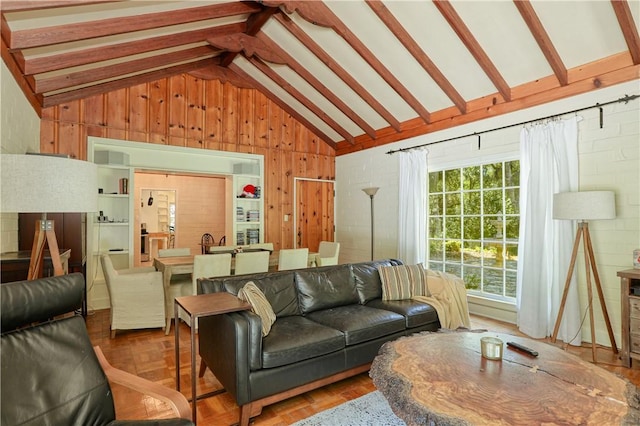 living room with wooden walls and vaulted ceiling