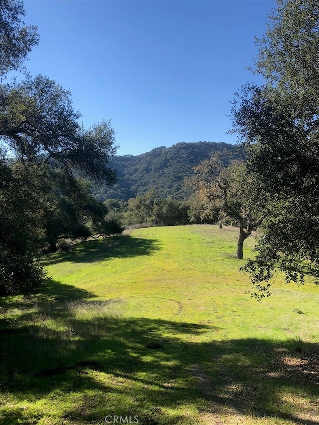 mountain view featuring a rural view