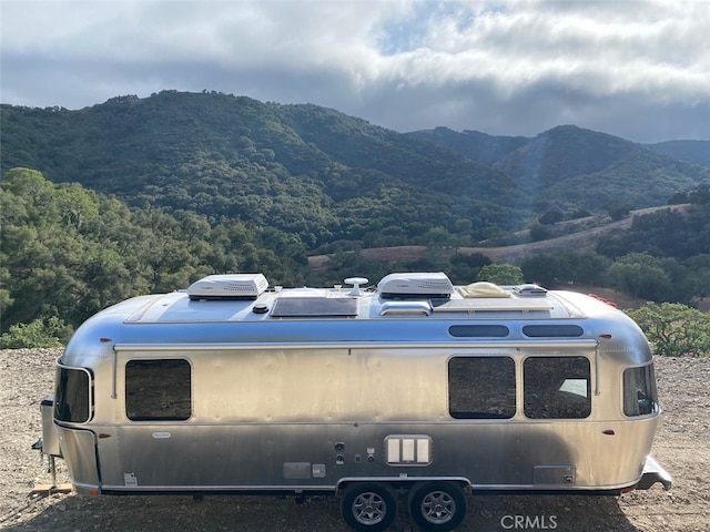 mountain view featuring a forest view