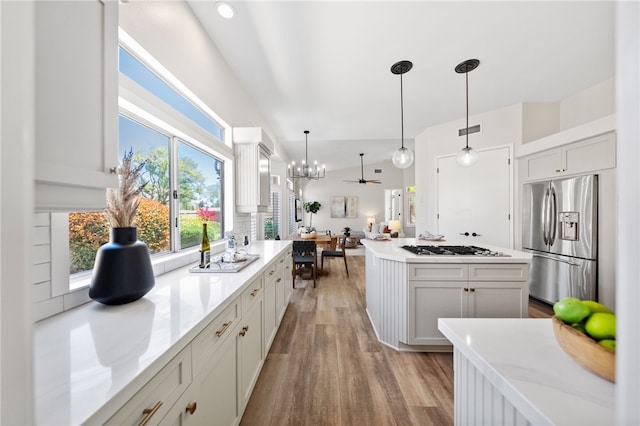 38027 Cherrywood Dr, Murrieta, CA 92562 - kitchen featuring stainless steel fridge with ice dispenser, a ceiling fan, light wood-style floors, gas cooktop, and decorative light fixtures