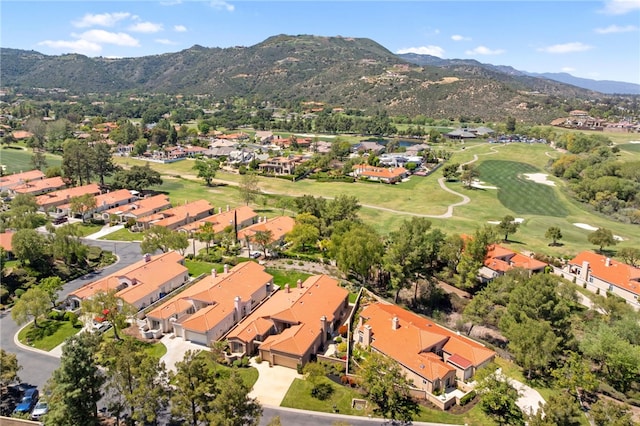 birds eye view of property with a residential view, view of golf course, and a mountain view