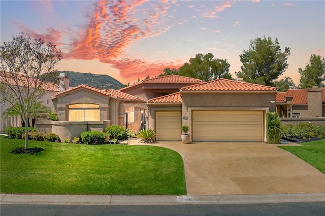 38027 Cherrywood Dr, Murrieta, CA 92562 - mediterranean / spanish-style house with an attached garage, a lawn, a tiled roof, stucco siding, and driveway