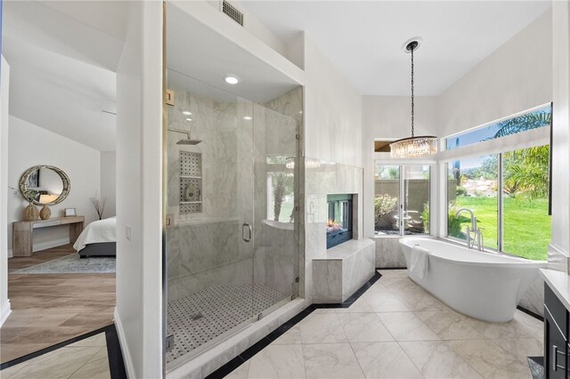 38027 Cherrywood Dr, Murrieta, CA 92562 - full bathroom with a freestanding tub, a marble finish shower, ensuite bath, marble finish flooring, and a chandelier
