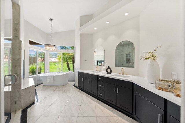 38027 Cherrywood Dr, Murrieta, CA 92562 - full bath featuring a freestanding tub, double vanity, a chandelier, a shower stall, and marble look tile flooring