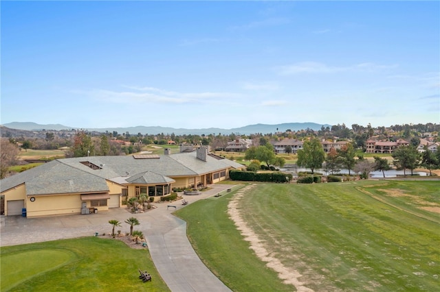 bird's eye view with a residential view, a mountain view, and view of golf course