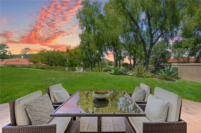 patio terrace at dusk with a yard