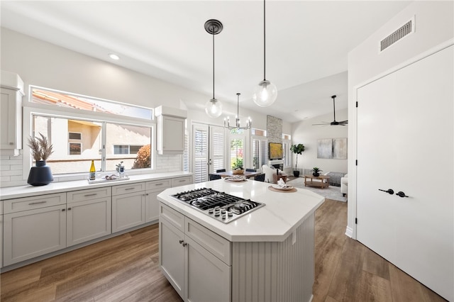 38027 Cherrywood Dr, Murrieta, CA 92562 - kitchen with stainless steel gas cooktop, decorative backsplash, light wood-style flooring, and recessed lighting
